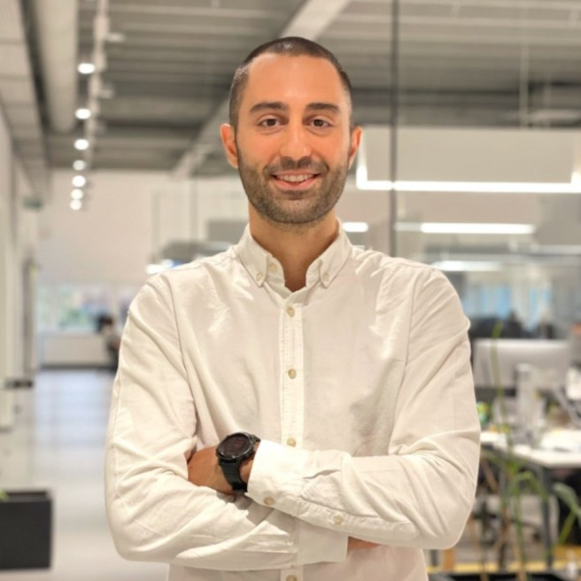 Baran Nalbantoğlu in a white shirt